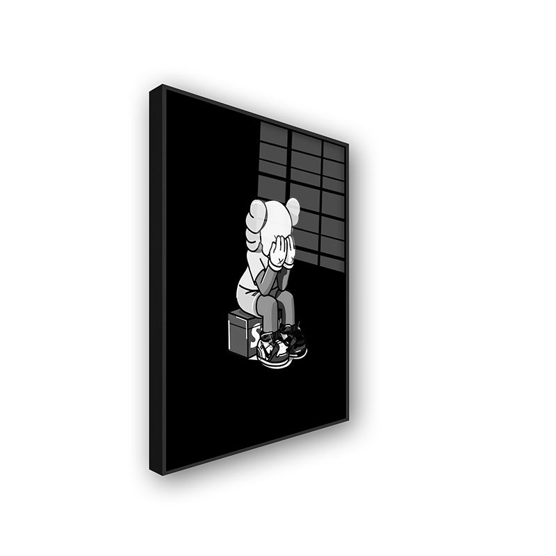 Painting of crying Kaws in a black frame sideview